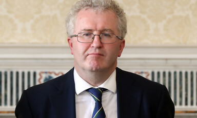 Man wearing spectacles and tie. 