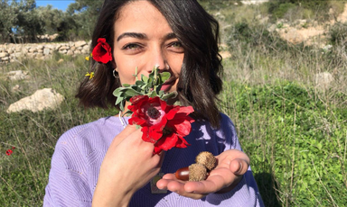 Palestinian student Mays Abu Ghosh holds flower