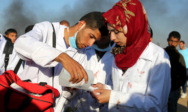 Two medics stand