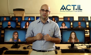 A man stands in front of a rows of desks with computer monitors