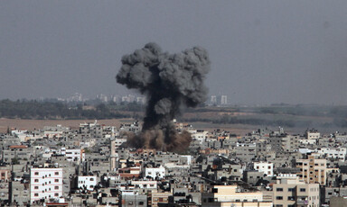 Smoke rises from crowded neighborhood