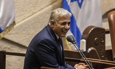 Man speaks at podium