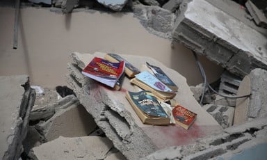 Books amid the rubble of a destroyed building 