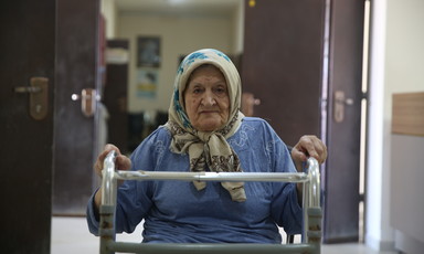 Woman holds a mobility aid 