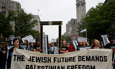 Marchers with banner that reads The Jewish future demands Palestinian freedom