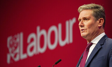 A man speaks from a podium