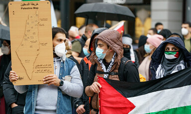 Protesters hold a map of Palestine