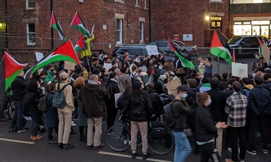 A crowd of protesters with flags