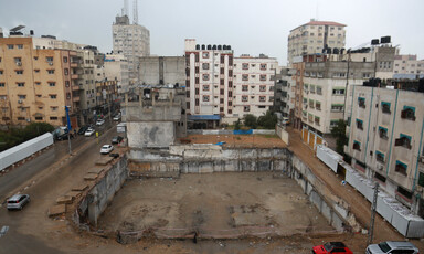 A space between housing blocs marks the place where al-Jawhara Tower used to stand