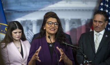 Three people at podium