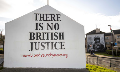 A mural reads There is No British Justice 