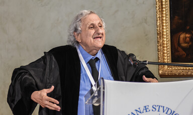 A man speaks at a podium