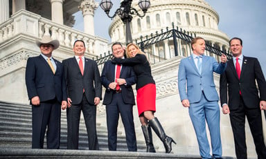 Six members of Congress stand on the House steps of the US Capitol Building