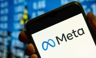 The Meta logo is seen on a mobile phone