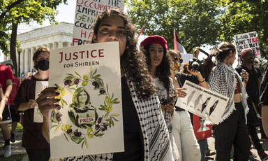 Protesters holding signs