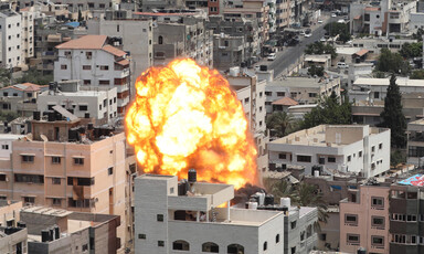 Massive explosion against city skyline