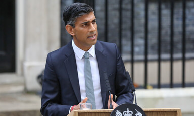 A man speaks from a lectern