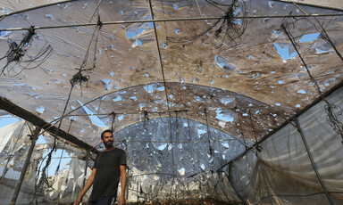 A man walks near the site of an Israeli attack on Gaza