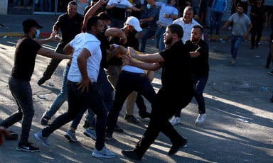 Men clash with uniformed security forces
