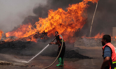 Firefighters tackle a blaze