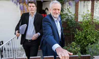 Two men leaving a house