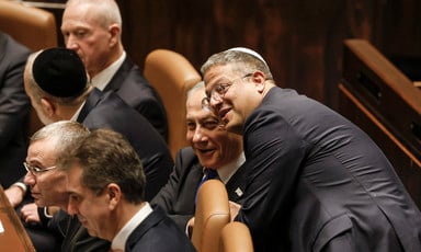 Itamar Ben-Gvir and Benjamin Netanyahu smile together in the Knesset, Israel's parliament