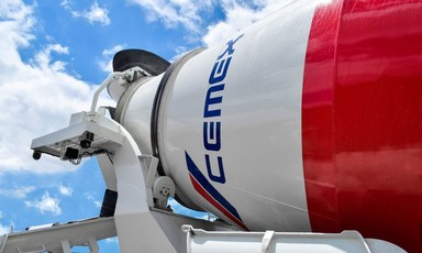 A cement truck with the logo of Cemex