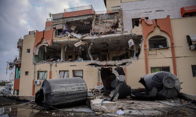 Gaping holes and damage to a Palestinian residential apartment