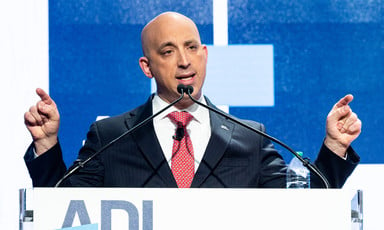 Jonathan Greenblatt of the ADL gesticulates from behind a podium at an ADL event