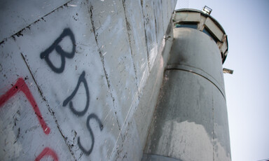 "BDS" written using spray paint on the separation wall 