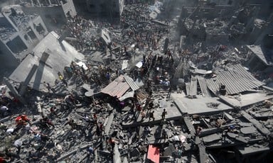 Palestinians amidst rubble in Khan Younis