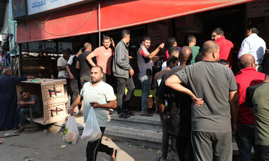 A line of people queuing for bread