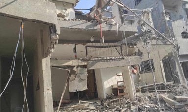A home destroyed by an Israeli airstrike is missing walls and windows