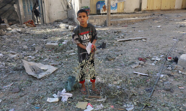 A boy stands amid the rubble in Gaza 