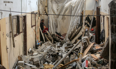 People search in what remains of a building in the southern Gaza city of Rafah 