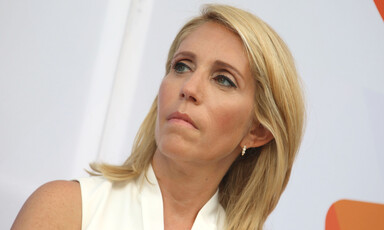 Dana Bash looks on at event