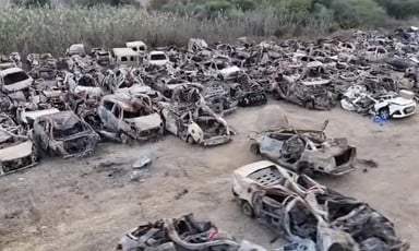 Destroyed cars in a field