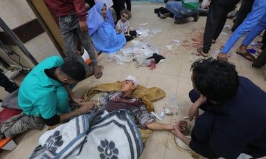 Blood stains can be seen on the ground of an overcrowded hospital in Gaza 