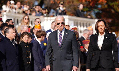 Joe Biden and Kamala Harris walk past a crowd