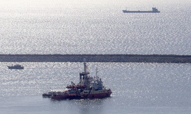 A boat is seen in a body water 