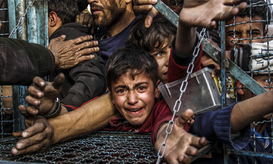 Palestinian children and adults try to secure food