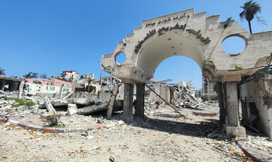 the rubble of demolished buildings in what remains of Gaza CIty