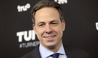 Jake Tapper grins during an event at Madison Square Garden in New York City