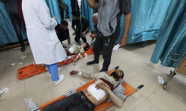 People are treated on the floor of a hospital