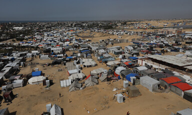 An aerial view of many makeshift tents in the sands of southern Gaza 