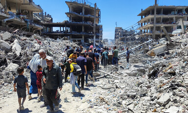 People walk amid rubble in northern Gaza 