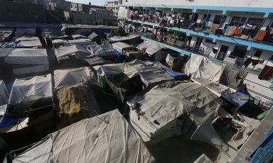 Rows of makeshift tents beside a school in Gaza 