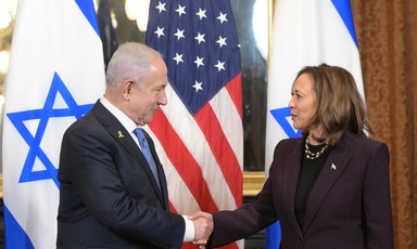 US Vice President Kamala Harris shakes hands with Israeli Prime Minister Benjamin Netanyahu with an American flag and two Israeli flags behind them