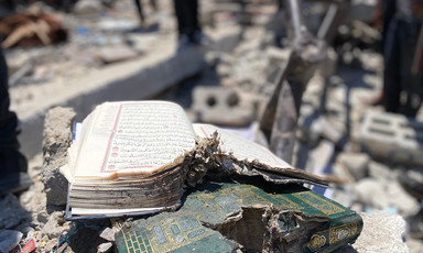 Damaged books lie in rubble