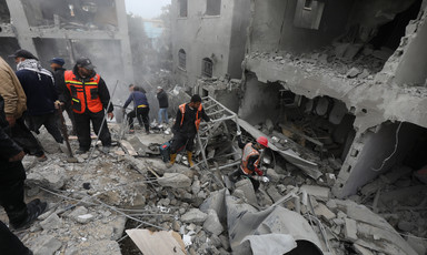 Emergency workers search rubble for survivors